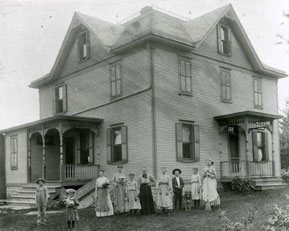 A Group of Women In front of a House in Black and White