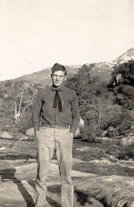 Black and White Image of a Man on a Plateau
