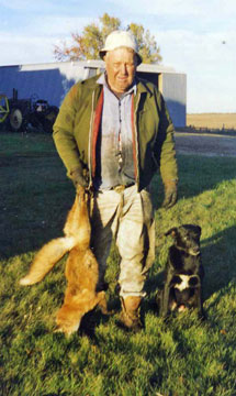 A Man Standingon a Field With Hunt