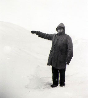 A Black and White Photo of a Man in Snow