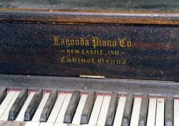 An Old Piano With Engraving on Wood