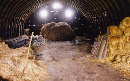 The Inside of a Wood Barn With Circular Roof